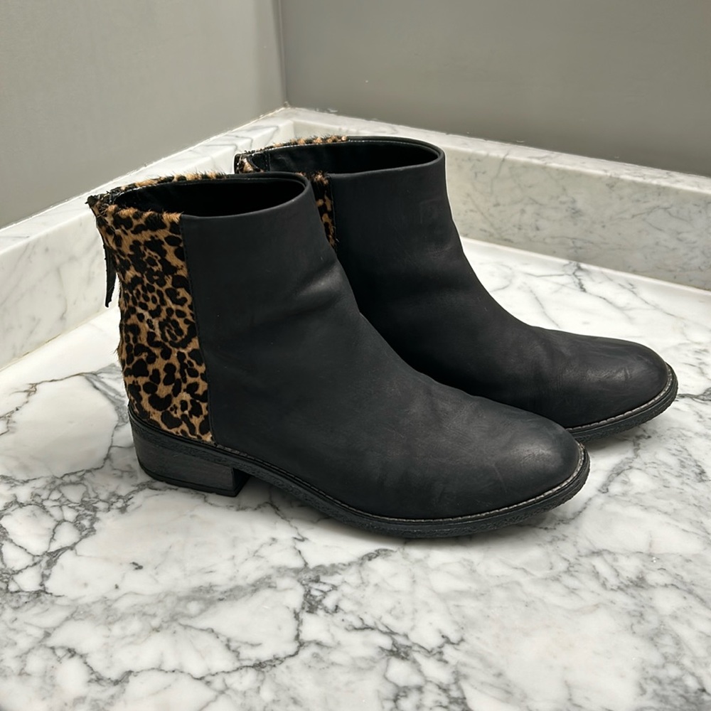 Sperry black booties with pony hair leopard print
